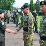 Danyonkes 1 Kostrad Pimpin Tradisi Penyambutan Personel Purna Tugas Satgas Mobile Yonif 330 Kostad