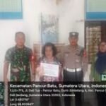 Babinsa Koramil 0201-14/PB Serda Romi Sidabalok Dampingi Penyaluran BLT di Desa Durin Simbelang