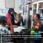Babinsa Koramil 14/PB Serda Darmono Aruan Tingkatkan Harmonisiasi dengan Perangkat Desa Baru melalui Komsos
