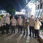 Babinsa Sertu Erlan Pastikan Pilkada di Martubung Berjalan Aman dan Lancar