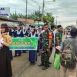 Danramil 0201-16/TM Ikut Berpartisipasi dalam Pawai Ta’aruf Pembukaan MTQ ke-58 di Galang